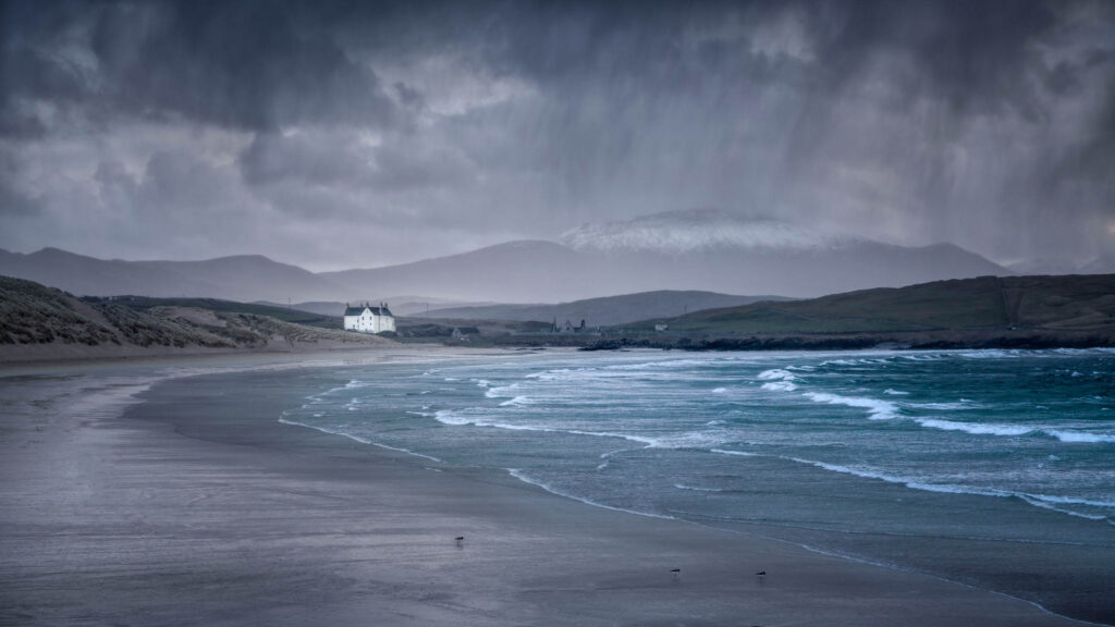 Photo of Balnakiel Beach in Scotland during a passing storm.