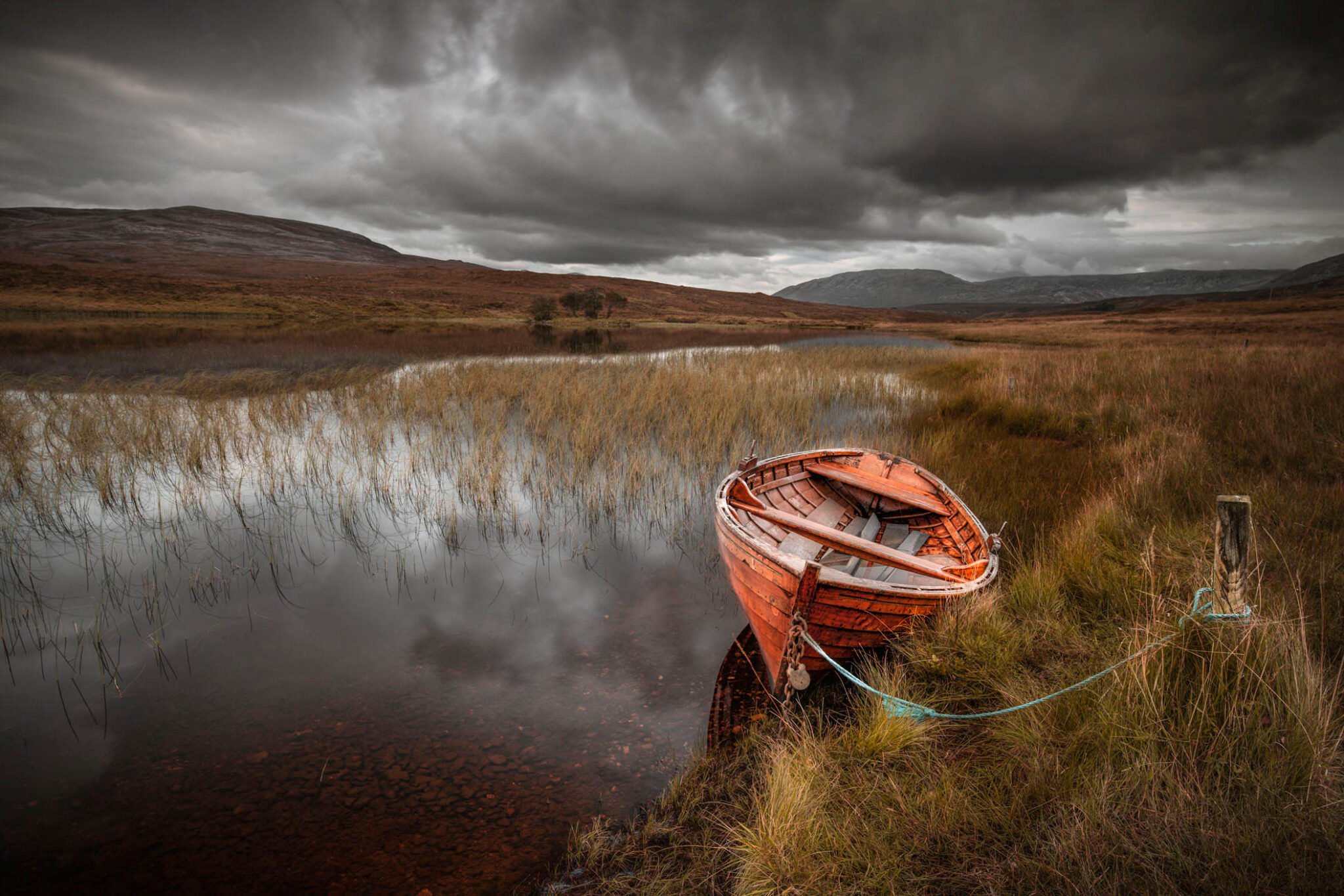 Boat moored at Loch Awe in Assynt, Scotland.